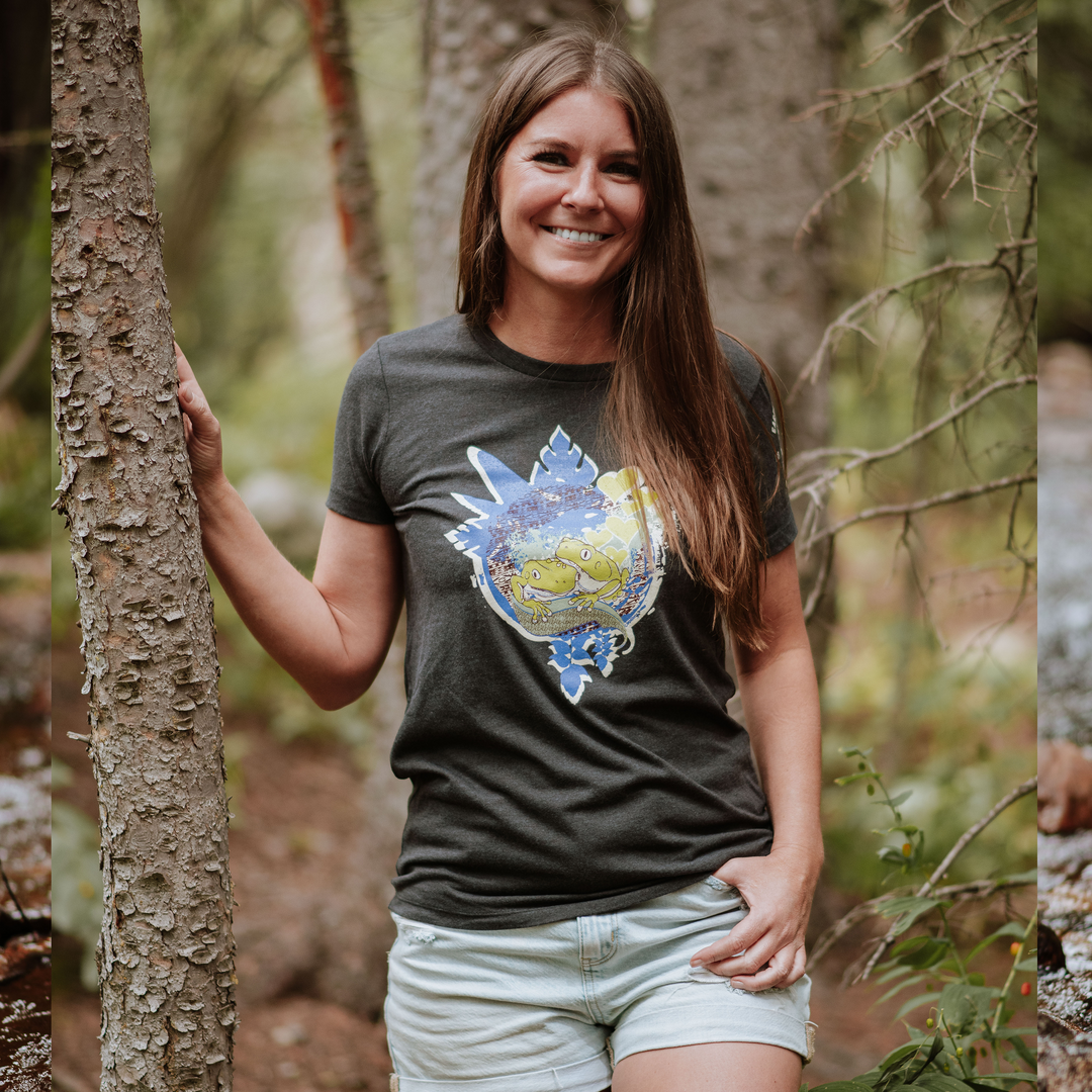 Woman wearing a t-shirt with a colorful design in a forest setting