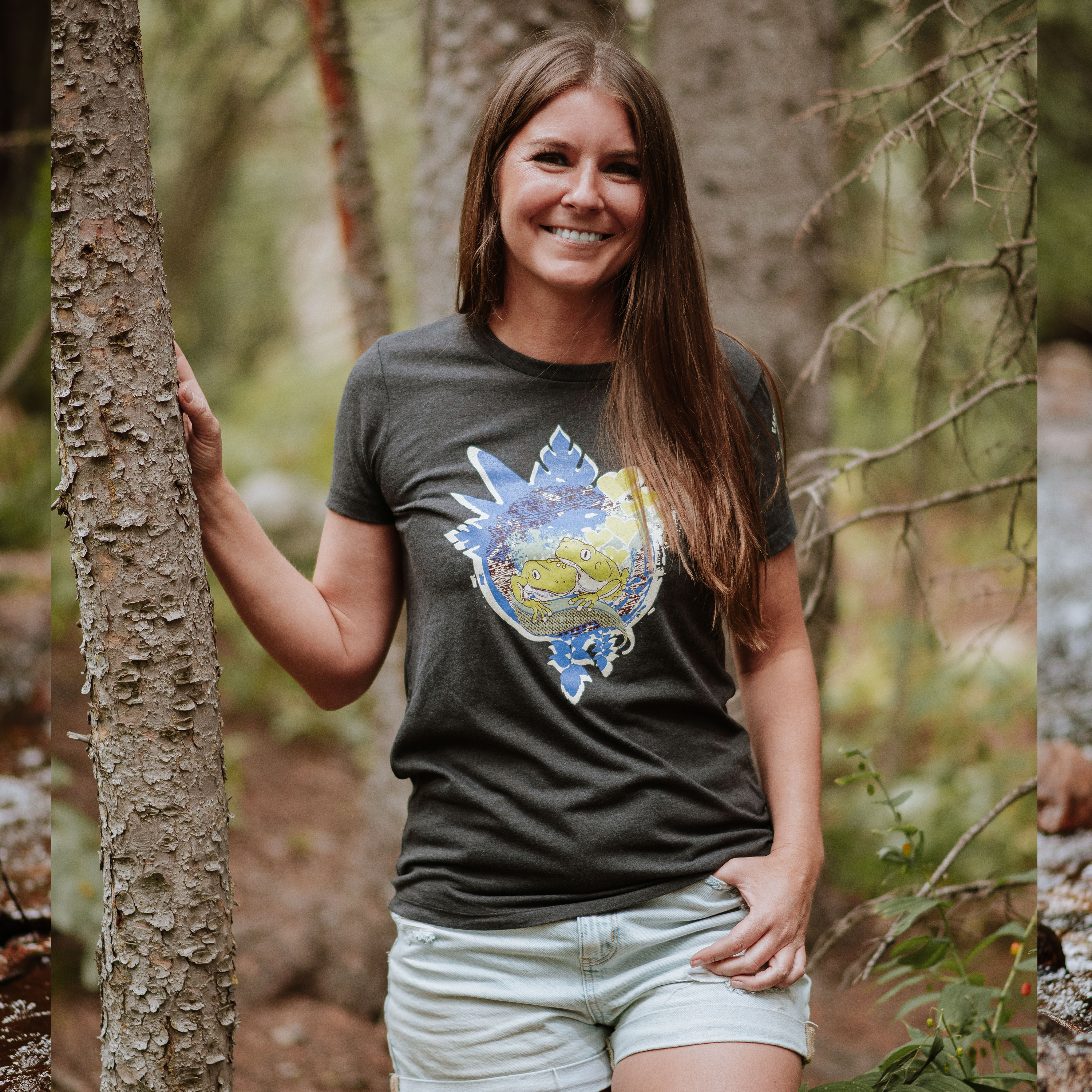 Woman wearing a t-shirt with a colorful design in a forest setting